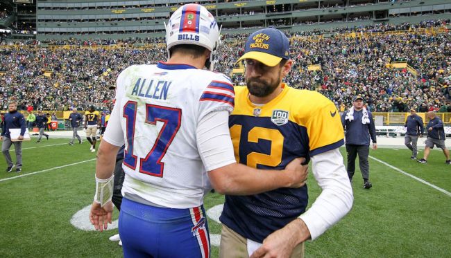 josh allen and aaron rodgers hugging on the field
