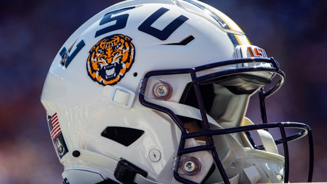 An LSU football helmet on the sidelines during a game.