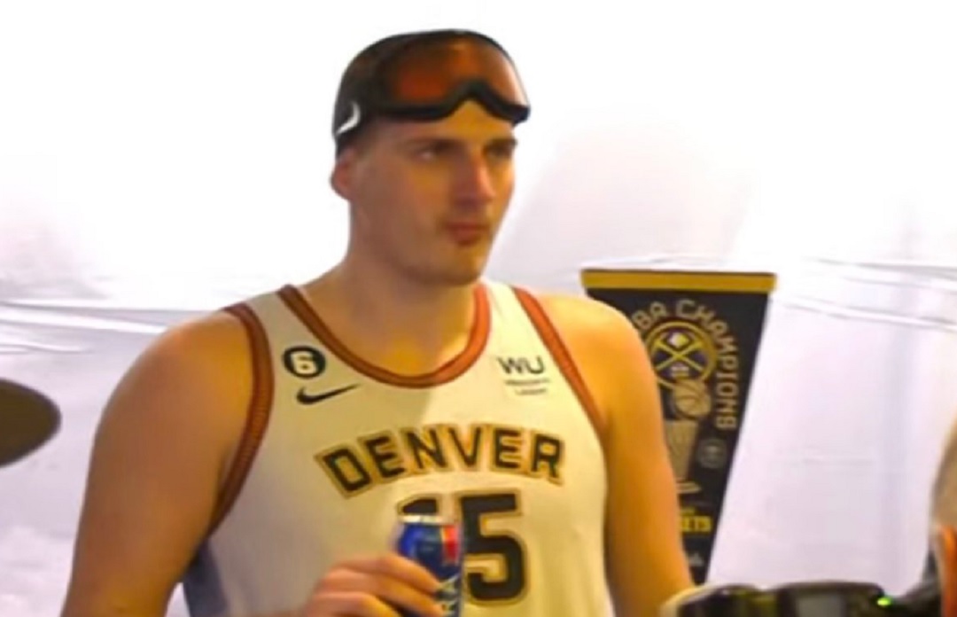 Nikola Jokic Awkwardly Standing By Himself With A Beer During NBA