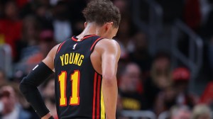 Trae Young reacts to a play during an Atlanta Hawks game.