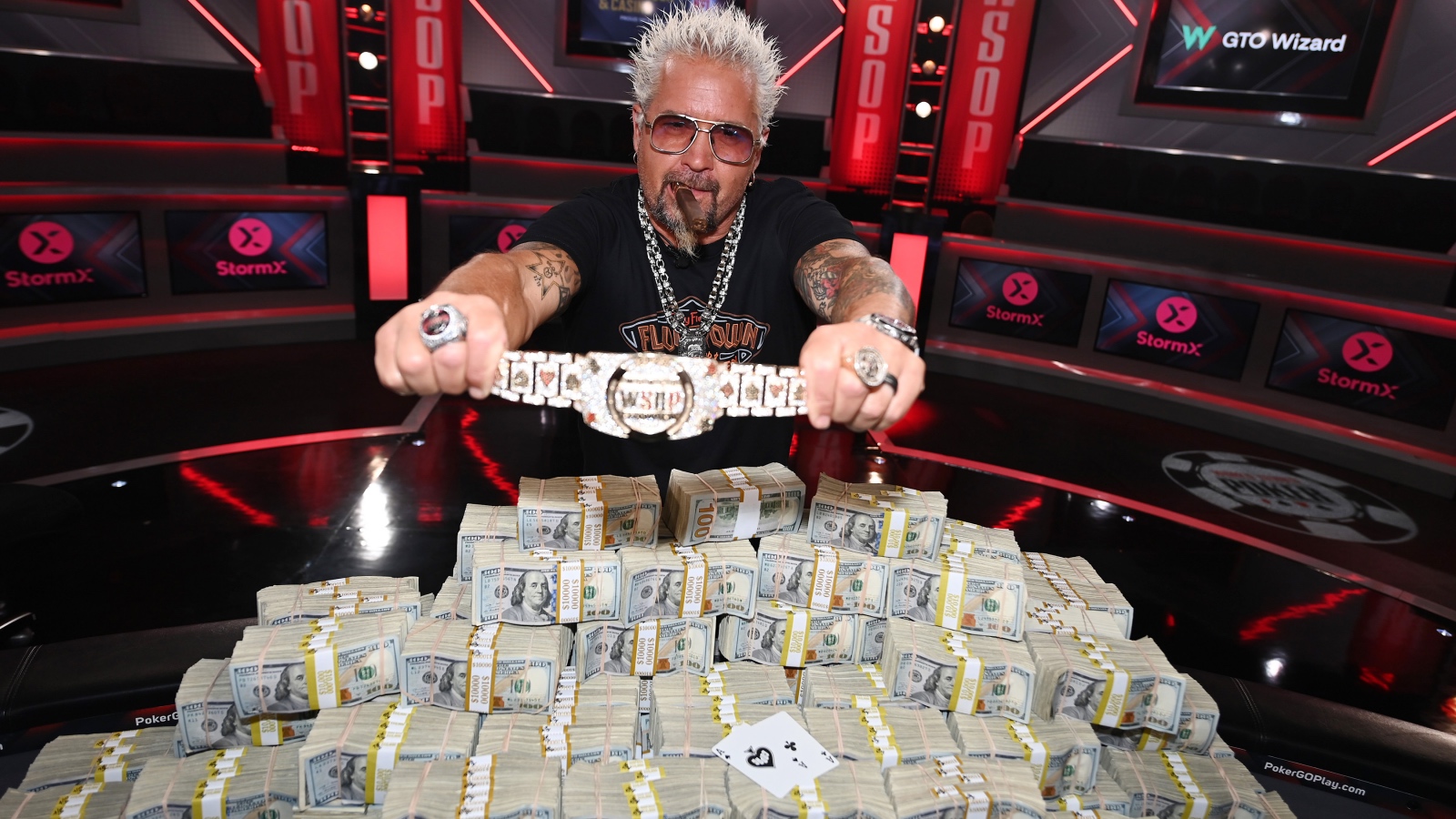 2023 World Series of Poker Main Event bracelet and cash held by Guy Fieri