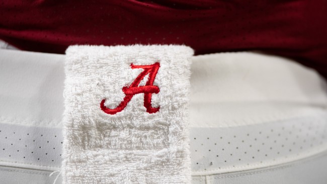 An Alabama logo on a towel worn by a football player.