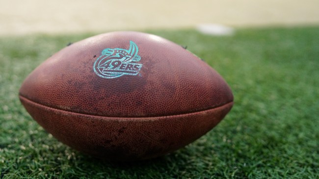 A Charlotte 49ers logo on a football.