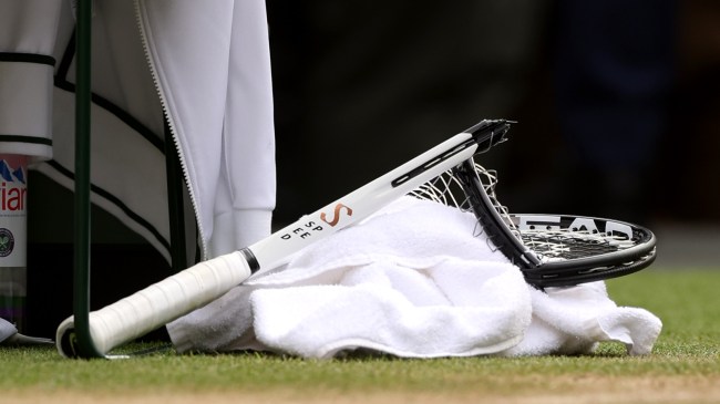 Novak Djokovic's smashed racket lays on the court at Wimbledon.