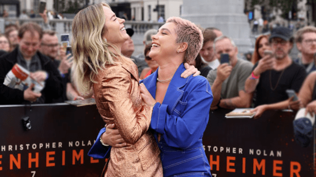 emily blunt and florence pugh embracing at the premiere of oppenheimer