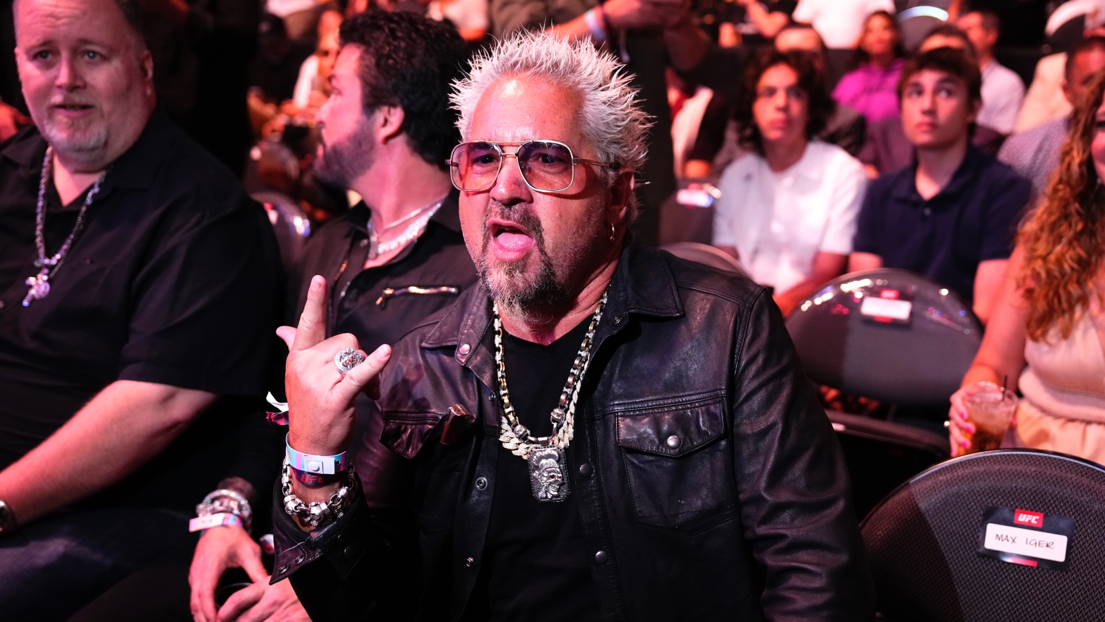 Guy Fieri showing the universal rock star sign
