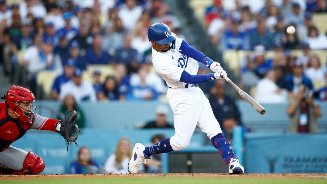 Mookie Betts makes contact with a pitch in a game between the Dodgers and Cardinals.