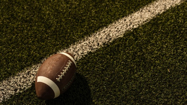 A football rests on the field.