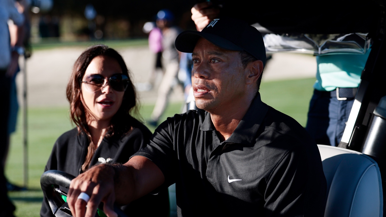 Tiger Woods and his ex girlfriend Erica Herman riding in a golf cart