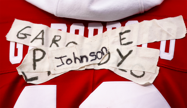 49ers jersey with quarterback names crossed off with tape