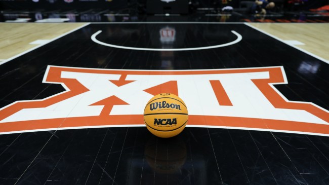 A Big XII logo on the basketball court.