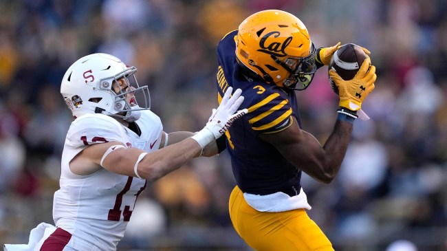 A Cal receiver hauls in a pass over a Stanford defender.