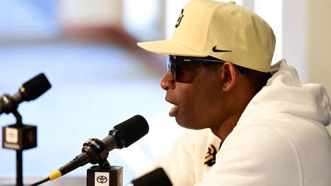 Deion Sanders answers questions at Colorado media day.
