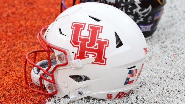 A Houston Cougars helmet in the endzone before a game.