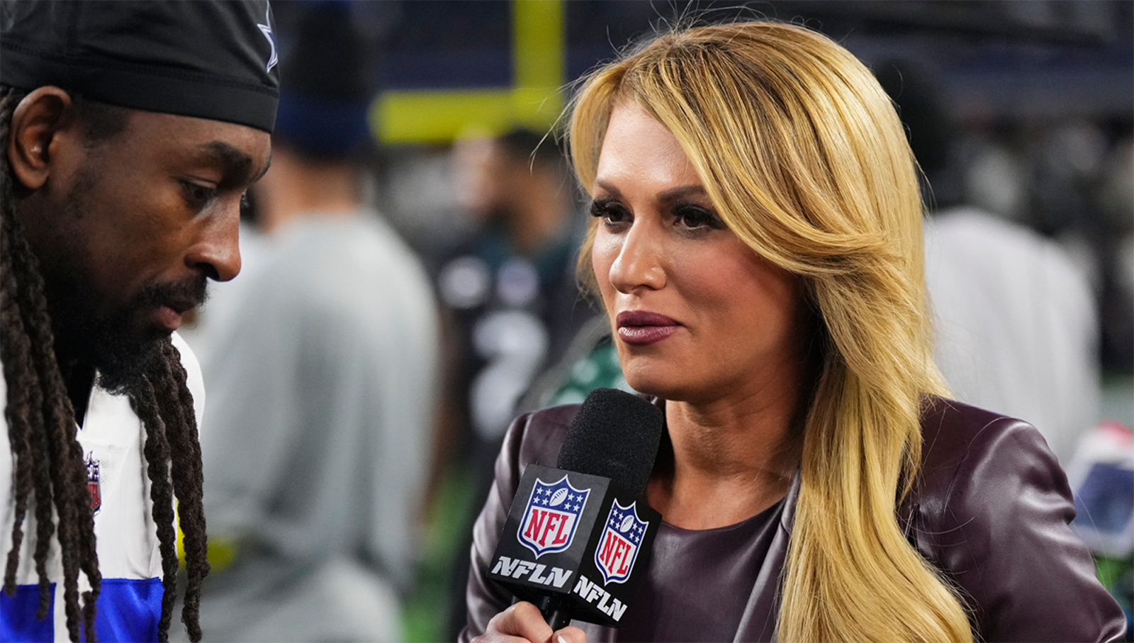 NFL network reporter Jane Slater poses after a report prior to an NFL  football game between the Carolina Panthers and the Dallas Cowboys, Sunday,  Oct. 3, 2021, in Arlington, Texas. (AP Photo/Matt