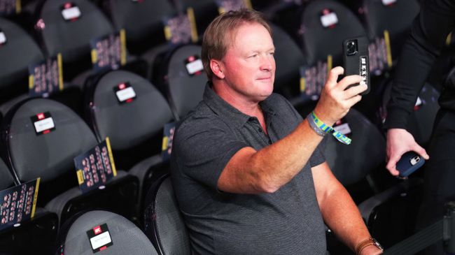 jon gruden holding up a cell phone