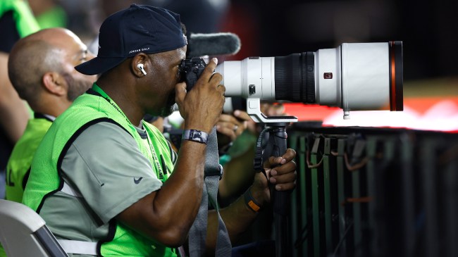 Ken Griffey Jr takes a photograph at the Inter Miami game.