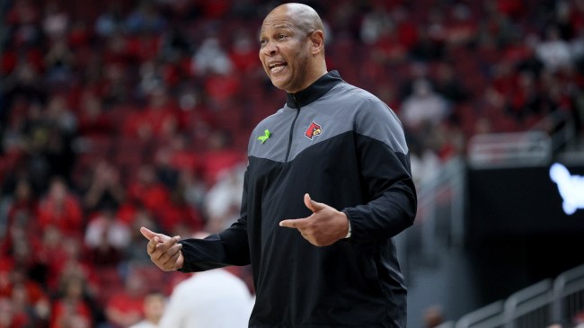 Kenny Payne coaches from the sidelines for Louisville.