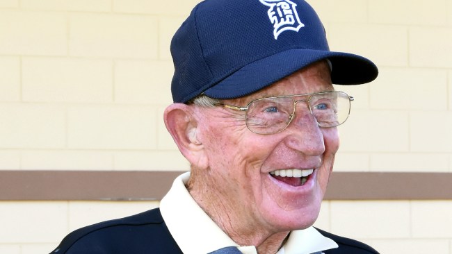 Lou Holtz attends a spring training baseball game.