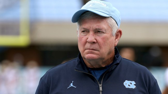 UNC coach Mack Brown watches on during pregame warm-ups.