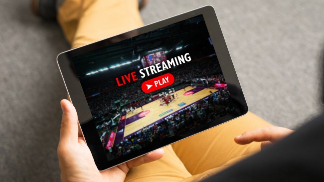 man streaming sports on tablet
