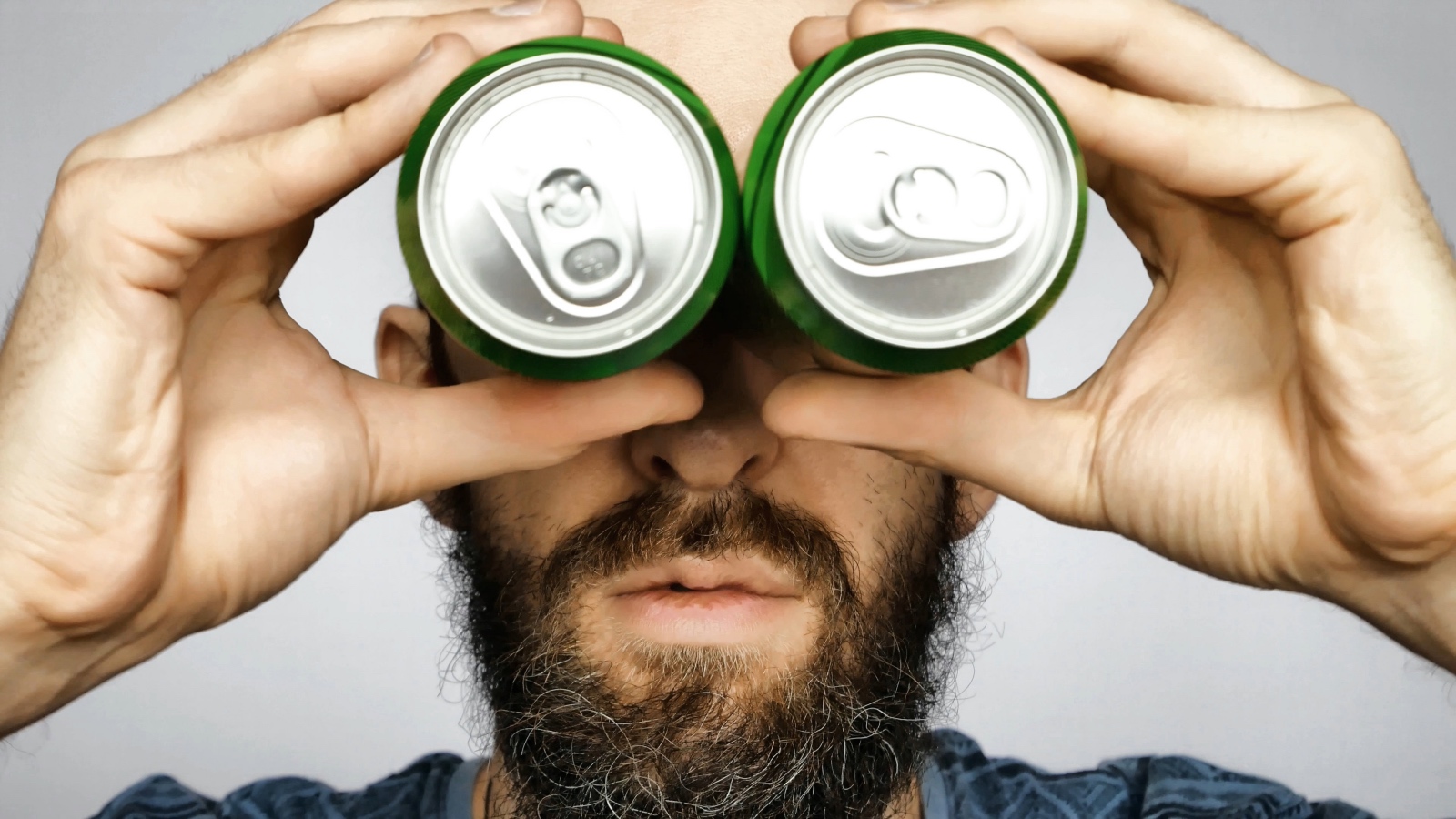 man with empty cans on his head