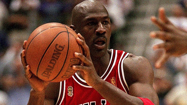 Michael Jordan of the Chicago Bulls jogs up court wearing his