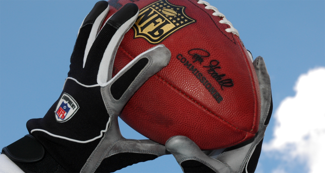 nfl receiver catching ball with gloves logo
