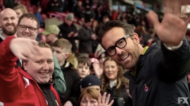 ryan reynolds waving to the camera in welcome to wrexham