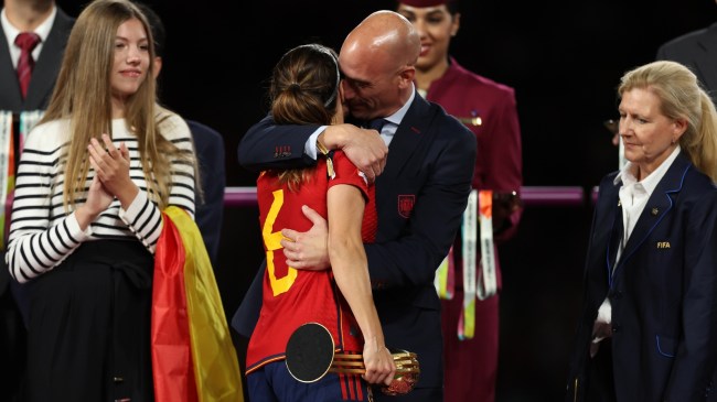 Spain soccer president Luis Rubiales kissing a player