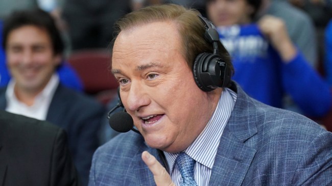 Tim Brando in the broadcast booth at a college basketball game.