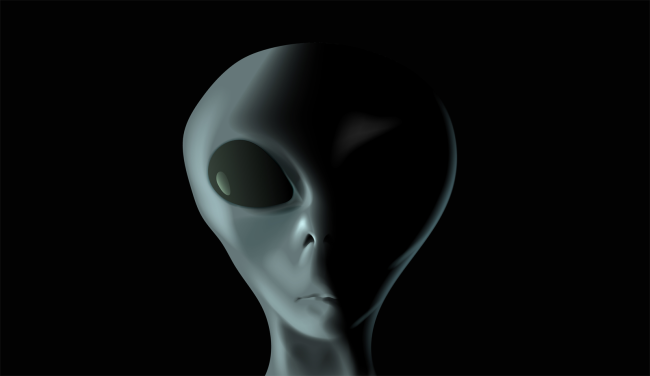 Alien face on black background