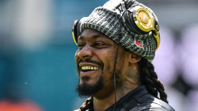 Marshawn Lynch laughing on sidelines