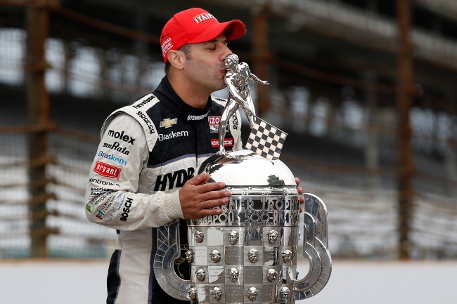 Tony Kanaan kisses Borg Warner trophy after winning Indianapolis 500