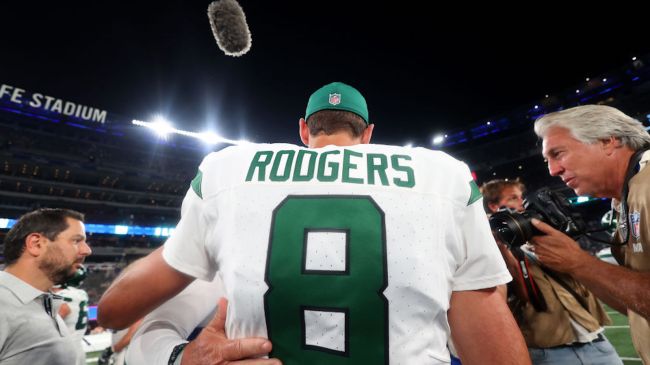 aaron rodgers in a white jets uniform
