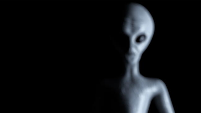 alien blurred on black background