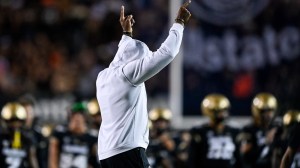 Deion Sanders on the field before a Colorado game against Colorado State.