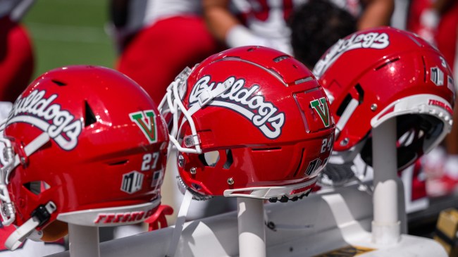 A line of helmets on the Fresno State bench.