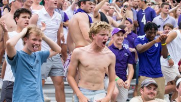 Holy Cross Fan Moons Boston College Crowd While Streaking Across Field During Torrential Downpour