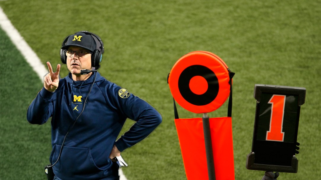 Jim Harbaugh serves as the chain gang at a youth football game