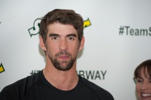 Michael Phelps in front of a Subway logo