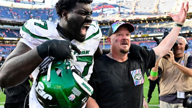 Nathaniel Hackett, and Mekhi Becton celebrating a win