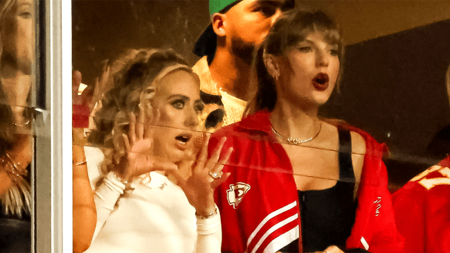 Taylor Swift and Brittany Mahomes watch from a box suite