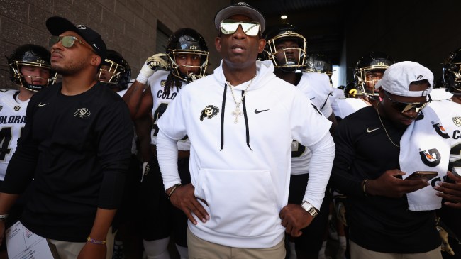 Deion Sanders walks out the tunnel with his Colorado football team.