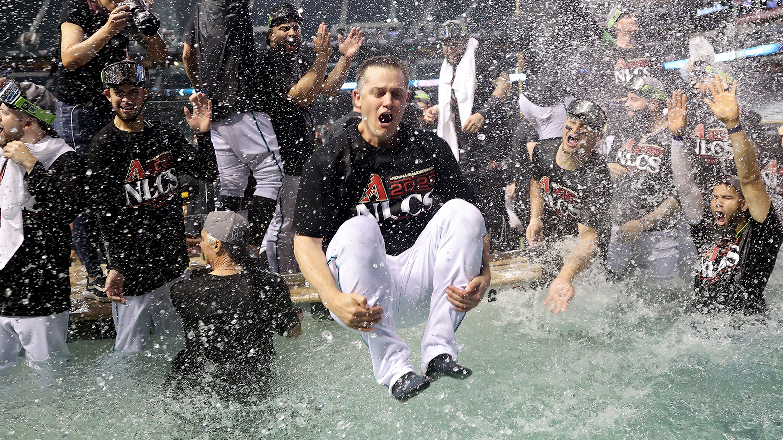 Fans celebrate outside Chase Field for the Arizona Diamondbacks