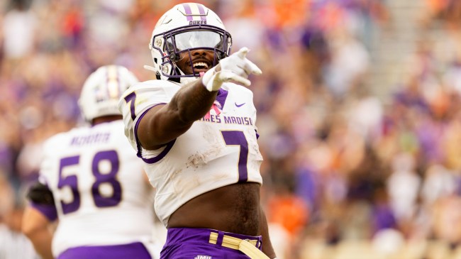 A James Madison player celebrates a big play during a game against Virginia.