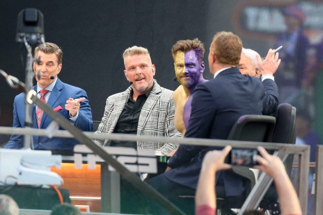 ESPN Gameday host Pat McAfee and former UW grad and comedian Joel McHale listen to Kirk Herbstreit talk during the filming of the ESPN Gameday show at the University of Washington for the college football game between the University of Washington and the Oregon Ducks