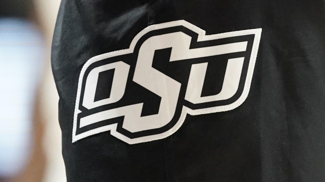 An Oklahoma State logo on a basketball player's shorts.