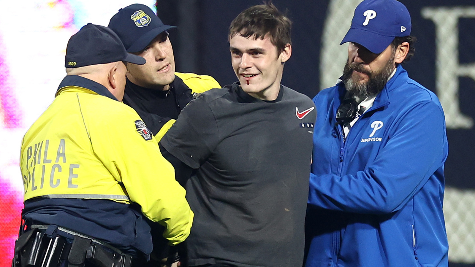 Cop Smiles After Catching Philadelphia Phillies Fan on Field