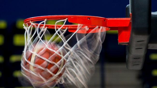 A basketball shot goes through the hoop.
